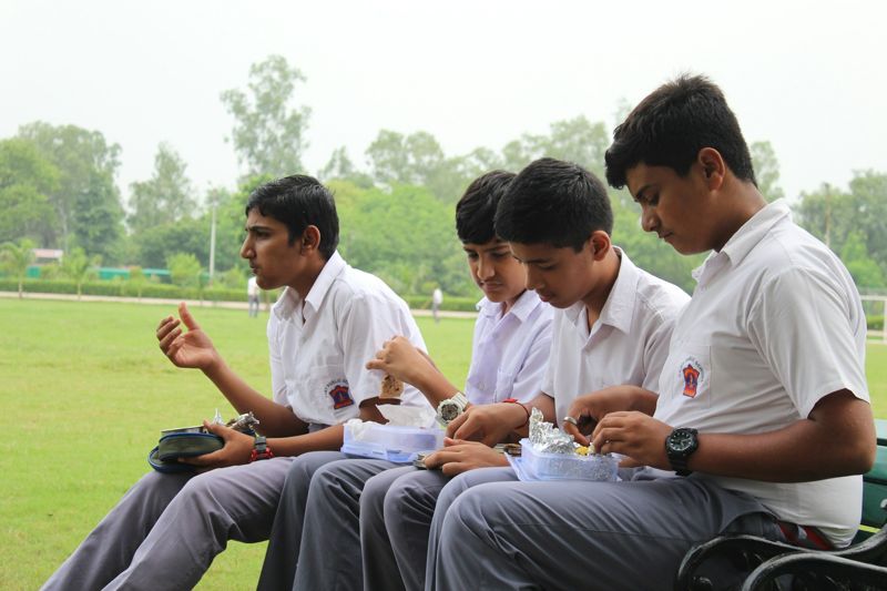 Senior students talking on the sports field
